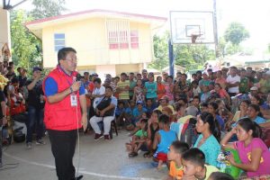 Department of Social Welfare and Development (DSWD) Region VIII Director Restituto Macuto speaks with displaced families staying in the municipal basketball court of Calbiga, Samar regarding the assistance that the DSWD will provide as they return to their homes following the grant to withdraw the presence of military forces in their barangays.