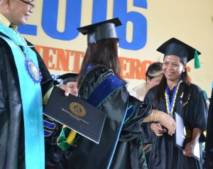 Pantawid Pamilya beneficiary, Jomalyn,  receives her Diploma, the fruit of her labor as scholar under the SGP-PA. 