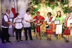 Representatives from Cordillera Administrative Region (CAR) receive distinction for their exemplary service to the community from (left to right) DSWD-Field Office CAR Regional Director Leo Quintilla, OIC-National Program Manager Ma. Consuelo Acosta, and Undersecretary for Operations Group Jerico Javier.